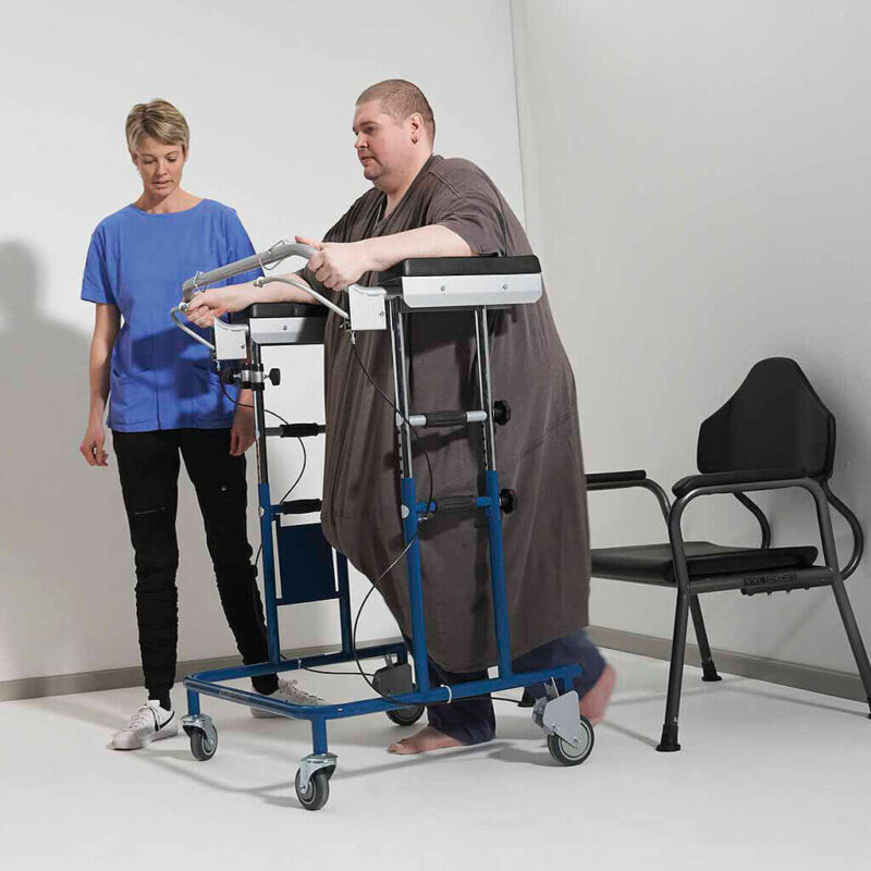 A man using a bariatric walking frame